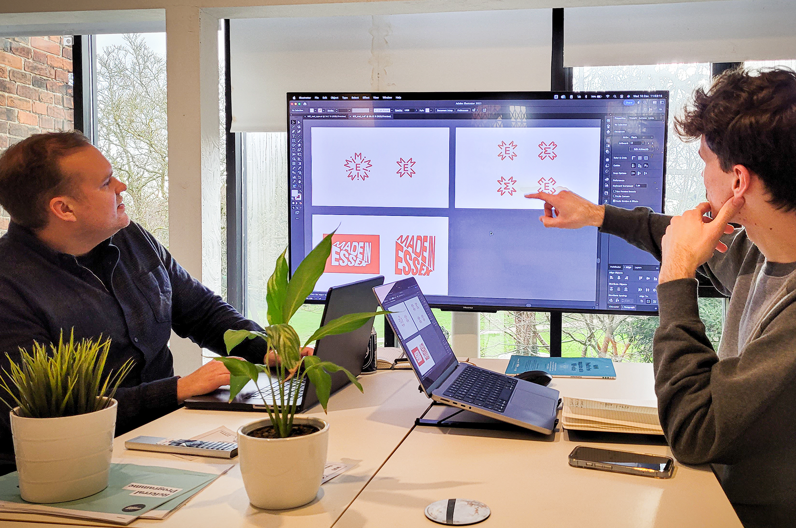 Designers reviewing branding concepts together